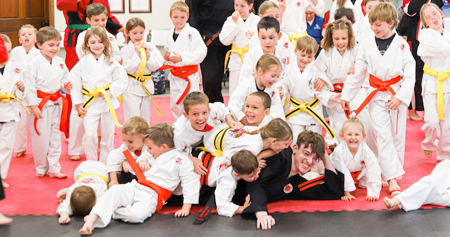Kids Karate Class tackles Senpai Mason after testing!